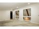 Large bonus room featuring a closet, neutral carpet and a view to the floor below at 600 Ponderosa Ct, Fayetteville, GA 30214
