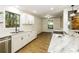 Modern kitchen with white cabinets, stainless steel appliances, and marble countertops, bright and airy at 600 Ponderosa Ct, Fayetteville, GA 30214