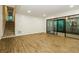 Bright living room with wood floors, stairs, and sliding glass doors leading to the outdoors at 600 Ponderosa Ct, Fayetteville, GA 30214