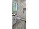 Bathroom featuring modern shower with frameless glass doors and modern vanity at 6093 Wayarer Dr, Villa Rica, GA 30180