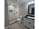 Modern bathroom with glass shower, subway tile, and stylish vanity at 6093 Wayarer Dr, Villa Rica, GA 30180