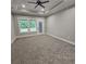 Large bedroom with natural light, plush carpet, and access to the backyard patio at 6093 Wayarer Dr, Villa Rica, GA 30180