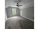 Spacious bonus room with neutral carpet, paint, and lots of natural light at 6093 Wayarer Dr, Villa Rica, GA 30180