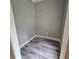 Small walk-in closet with vinyl flooring and room for storage at 6093 Wayarer Dr, Villa Rica, GA 30180