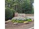 Welcoming Fairfield Plantation entrance sign surrounded by manicured landscaping and trees at 6093 Wayarer Dr, Villa Rica, GA 30180