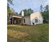 Beautiful home exterior with spacious yard and partially covered patio at 6093 Wayarer Dr, Villa Rica, GA 30180