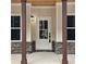 Charming front entrance with stone accents and decorative columns at 6093 Wayarer Dr, Villa Rica, GA 30180