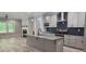 Open floorplan kitchen featuring gray cabinets, granite countertops, stainless steel appliances, and an island at 6093 Wayarer Dr, Villa Rica, GA 30180
