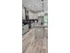 Modern kitchen featuring gray cabinets, granite countertops, stainless steel appliances, and an island at 6093 Wayarer Dr, Villa Rica, GA 30180