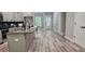 Modern kitchen featuring gray cabinets, granite countertops, stainless steel appliances, and an island at 6093 Wayarer Dr, Villa Rica, GA 30180