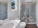Bathroom featuring a marble shower with a bench and a single vanity with dual fixtures at 107 Cedar Brook Dr, Canton, GA 30115