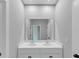 Bright bathroom with dual sinks, modern vanity, and large mirror for shared use at 107 Cedar Brook Dr, Canton, GA 30115