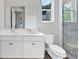 Bathroom with dual sinks, shower, and modern fixtures at 107 Cedar Brook Dr, Canton, GA 30115