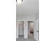 Neutral bedroom with doors to closets and hallways allowing convenient access to other areas at 107 Cedar Brook Dr, Canton, GA 30115