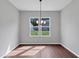 Well lit dining room with hardwood floors and modern light fixture at 107 Cedar Brook Dr, Canton, GA 30115