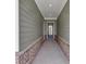 Inviting entryway with gray wood-look siding and a charming front door with glass panels at 107 Cedar Brook Dr, Canton, GA 30115
