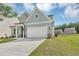 Charming two-story home with a well-manicured lawn, inviting front entrance and an attached garage at 107 Cedar Brook Dr, Canton, GA 30115