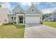 Charming two-story home with a well-manicured lawn, a two-car garage and inviting curb appeal at 107 Cedar Brook Dr, Canton, GA 30115