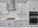 Modern kitchen with stainless steel appliances and white subway tile backsplash at 107 Cedar Brook Dr, Canton, GA 30115