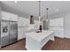 Gourmet kitchen featuring a large island, stainless steel appliances, and ample cabinetry at 107 Cedar Brook Dr, Canton, GA 30115