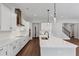 Modern kitchen featuring a stainless steel hood and appliances and recessed lighting at 107 Cedar Brook Dr, Canton, GA 30115