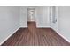 Spacious living room featuring wood flooring and an entrance door at 107 Cedar Brook Dr, Canton, GA 30115