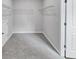 Empty walk-in closet with wire shelving and carpeted floors at 107 Cedar Brook Dr, Canton, GA 30115