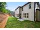 Two-story home featuring a back yard and green space at 2432 Whites Rdg, Decatur, GA 30034