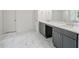 Elegant bathroom with marble flooring, a double vanity, and modern fixtures, offering a spa-like experience at 2432 Whites Rdg, Decatur, GA 30034