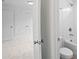 Bright bathroom featuring a shower and tub combo and white subway tile surround at 2432 Whites Rdg, Decatur, GA 30034