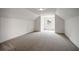 Large carpeted bedroom with vaulted ceilings and natural light at 2432 Whites Rdg, Decatur, GA 30034