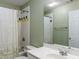 Bathroom with a shower featuring an interesting tile motif at 2810 Promenade Pl, Buford, GA 30519