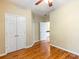 Bedroom featuring hardwood floors and an attached bath at 2810 Promenade Pl, Buford, GA 30519