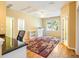 Bright bedroom featuring hardwood floors, a ceiling fan and natural light at 2810 Promenade Pl, Buford, GA 30519