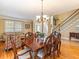 Elegant dining room with hardwood floors, natural light, and a cozy atmosphere at 2810 Promenade Pl, Buford, GA 30519