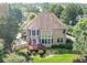Aerial back view of a house with a deck and backyard at 2810 Promenade Pl, Buford, GA 30519