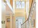 Grand foyer with high ceilings, natural light, and an elegant staircase at 2810 Promenade Pl, Buford, GA 30519