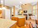 Open kitchen with granite counters, stainless appliances and view to the living room and staircase at 2810 Promenade Pl, Buford, GA 30519