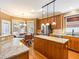 Spacious kitchen featuring granite countertops, stainless steel appliances, and a breakfast bar at 2810 Promenade Pl, Buford, GA 30519