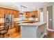 Open kitchen with granite countertops, stainless steel appliances, and a breakfast bar seating area at 2810 Promenade Pl, Buford, GA 30519