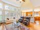 Bright living room with large windows, hardwood floors, and an open layout to the kitchen at 2810 Promenade Pl, Buford, GA 30519