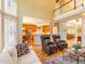 Bright and open living room featuring a cozy seating area and views of the kitchen at 2810 Promenade Pl, Buford, GA 30519