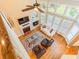 Bright living room featuring a fireplace, large windows, and hardwood flooring at 2810 Promenade Pl, Buford, GA 30519
