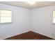 Bedroom with hardwood floors and two windows offering ample natural light at 579 Kenridge Cir, Stone Mountain, GA 30083