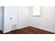 Bedroom featuring hardwood floors, natural light, and a closet for storage at 579 Kenridge Cir, Stone Mountain, GA 30083