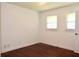 Bedroom featuring hardwood floors, natural light, and two bright windows at 579 Kenridge Cir, Stone Mountain, GA 30083