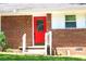 Close-up of a red front door with white trim and brick facade at 579 Kenridge Cir, Stone Mountain, GA 30083