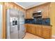 Kitchen boasting stainless steel appliances, and ample counter space at 65 Millennial Ct, Lawrenceville, GA 30045