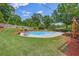 Enjoy the sparkling pool, swing set, and well-manicured yard, perfect for outdoor fun and relaxation at 65 Millennial Ct, Lawrenceville, GA 30045