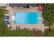 Overhead shot of sparkling pool with lounge chairs, diving board, and landscaped garden at 208 Eagles Flight, Villa Rica, GA 30180
